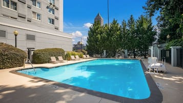 Seasonal outdoor pool, open 8:00 AM to 8:00 PM, pool loungers