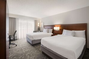 Premium bedding, desk, laptop workspace, blackout curtains