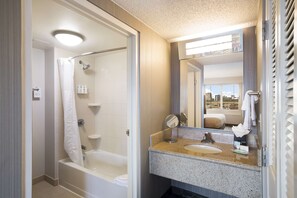 A modern bathroom with a shower, toilet, and sink. - Sonesta Select Atlanta Midtown Georgia Tech (Atlanta)