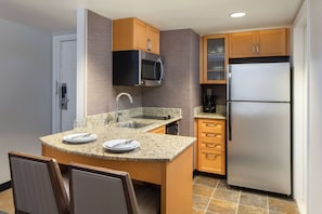 Full-sized fridge, microwave, stovetop, dishwasher