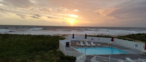 Seasonal outdoor pool, open 9:00 AM to 8:00 PM, pool umbrellas