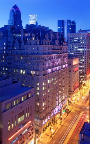 Standing tall in the heart of the city, this high-rise building showcases its classic architectural style with ornate detailing.