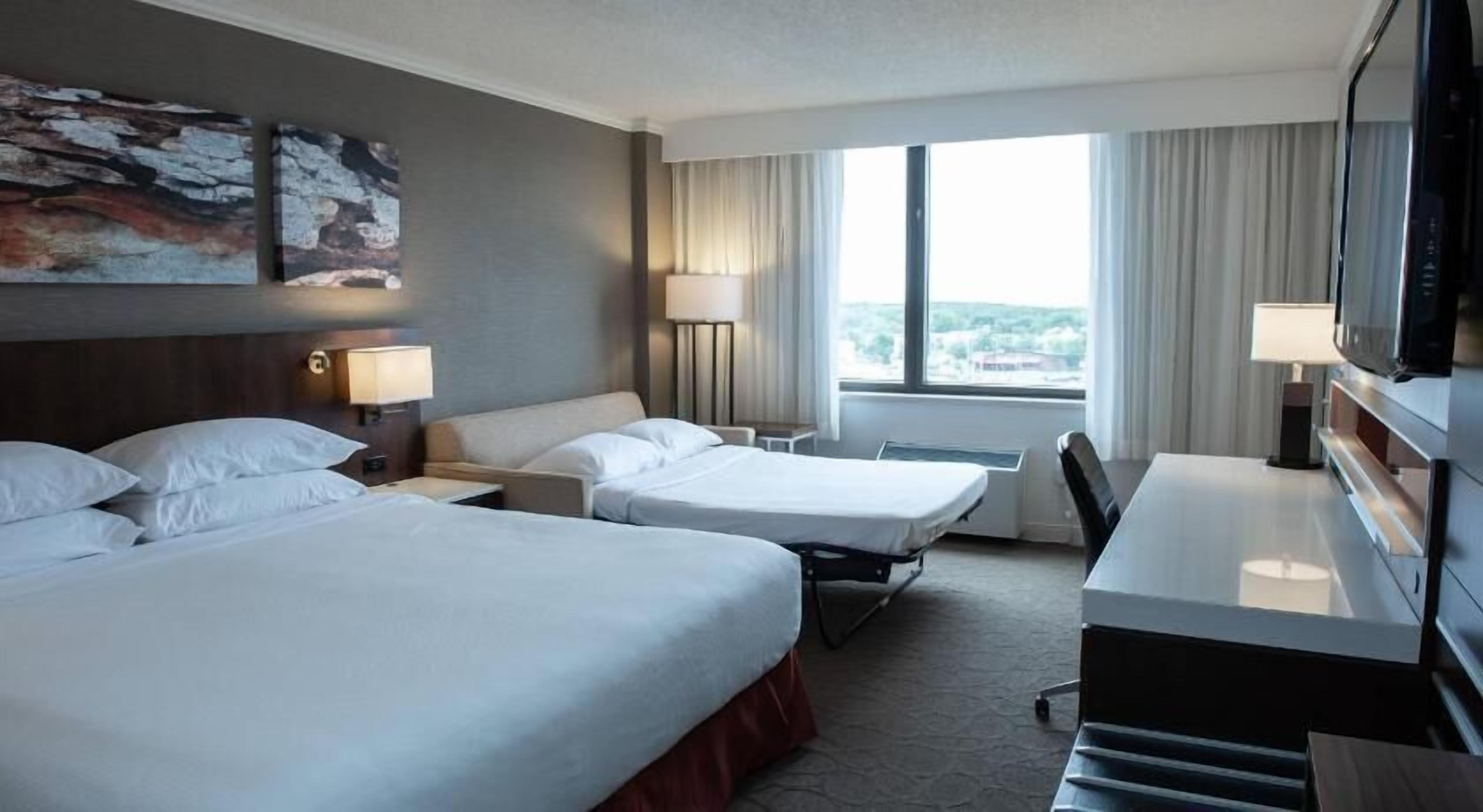 Hypo-allergenic bedding, desk, laptop workspace, blackout curtains