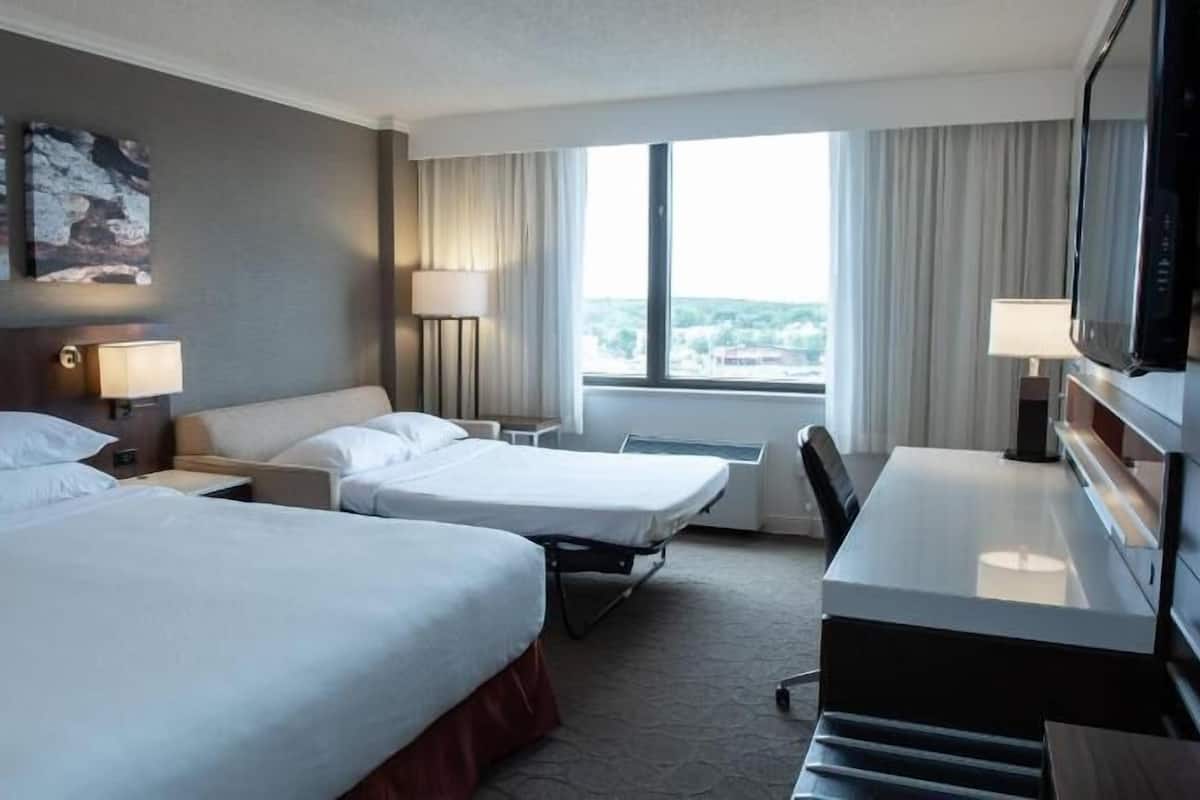 Hypo-allergenic bedding, desk, laptop workspace, blackout curtains