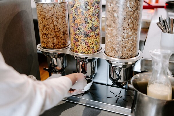 A coffee machine dispensing coffee into a cup.