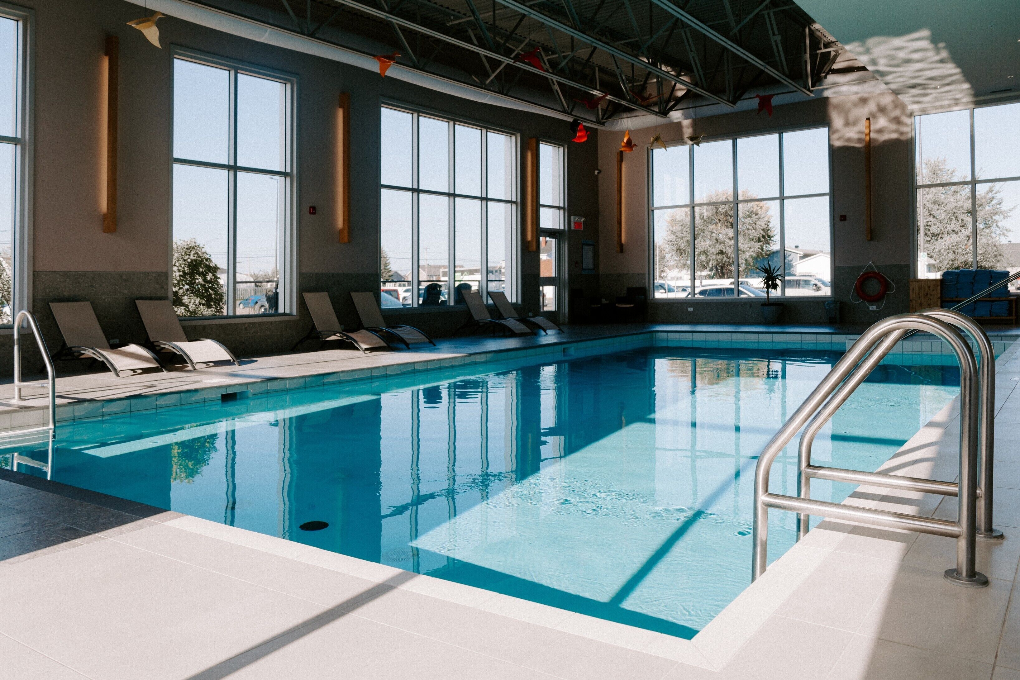 Indoor pool, open 8:00 AM to 10:00 PM, pool umbrellas, pool loungers