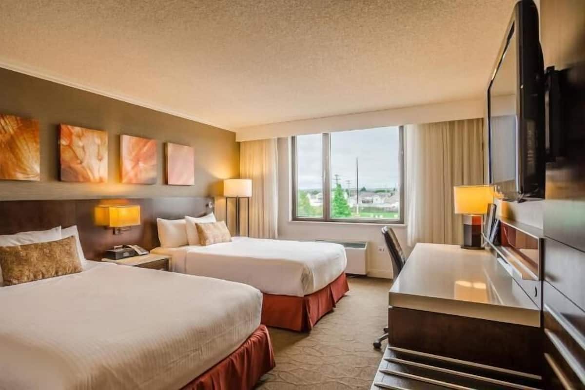 Hypo-allergenic bedding, desk, laptop workspace, blackout curtains