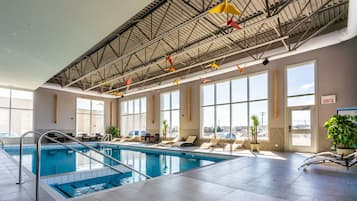 Indoor pool, pool umbrellas, pool loungers