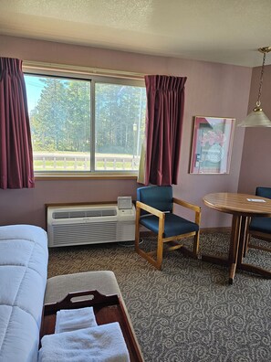 Deluxe Room, 1 King Bed, Jetted Tub (Jacuzzi) | Blackout curtains, iron/ironing board, free WiFi, bed sheets