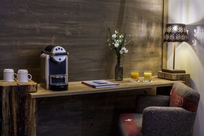 Relax in this inviting room with a wooden desk, comfortable chair, and warm ambiance.