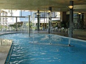 Indoor pool, open 10:00 AM to 1:30 PM, pool loungers