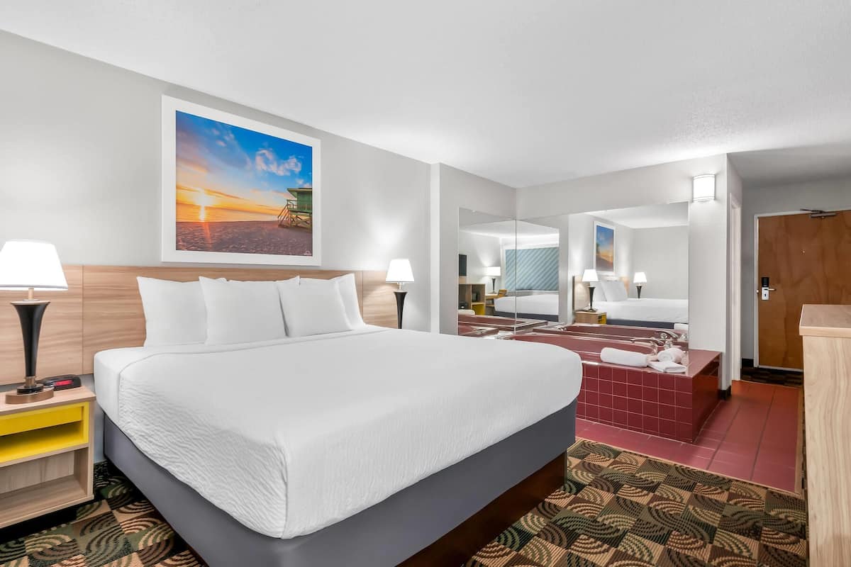 Standard Room, 1 King Bed, Jetted Tub | Desk, iron/ironing board, free cots/infant beds, rollaway beds