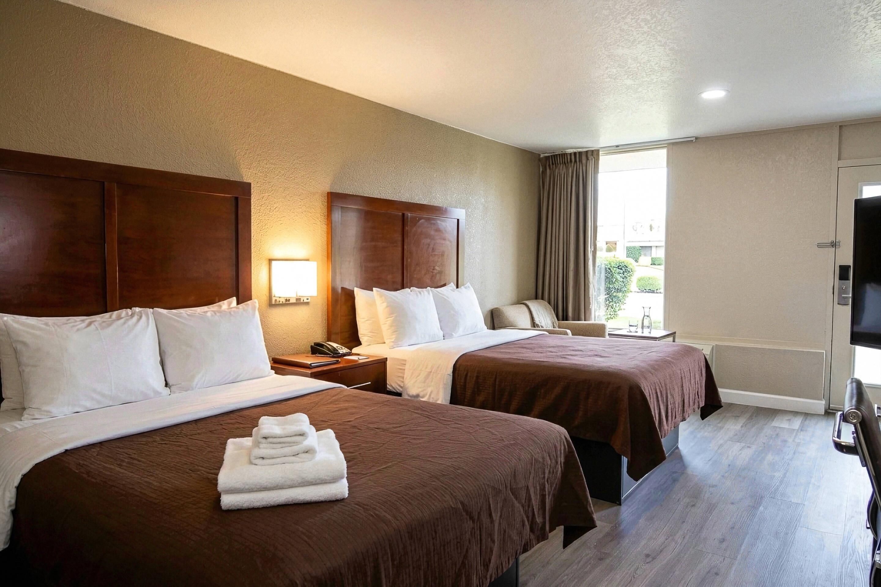 Room, 2 Queen Beds, Non Smoking | Desk, laptop workspace, blackout drapes, iron/ironing board