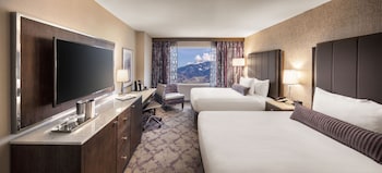 Premium bedding, pillowtop beds, in-room safe, desk at Silver Legacy Reno- A Caesars Rewards Destination