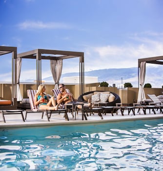 Outdoor pool, open 9:00 AM to 8:00 PM, cabanas (surcharge), sun loungers at Silver Legacy Reno- A Caesars Rewards Destination