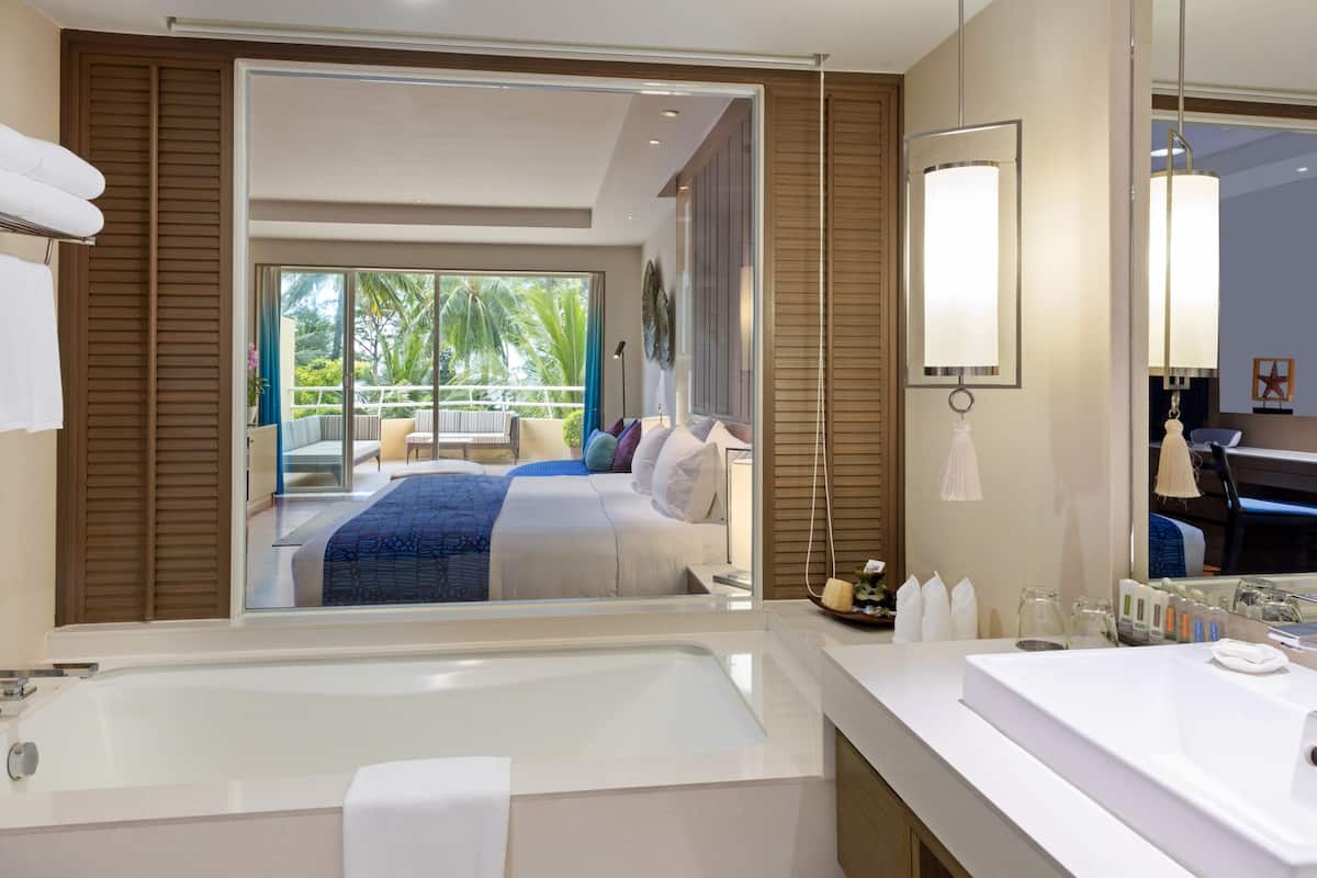suite, 1 king bed, pool view (furnished balcony) | bathroom | shower, rainfall showerhead, free toiletries, hair dryer