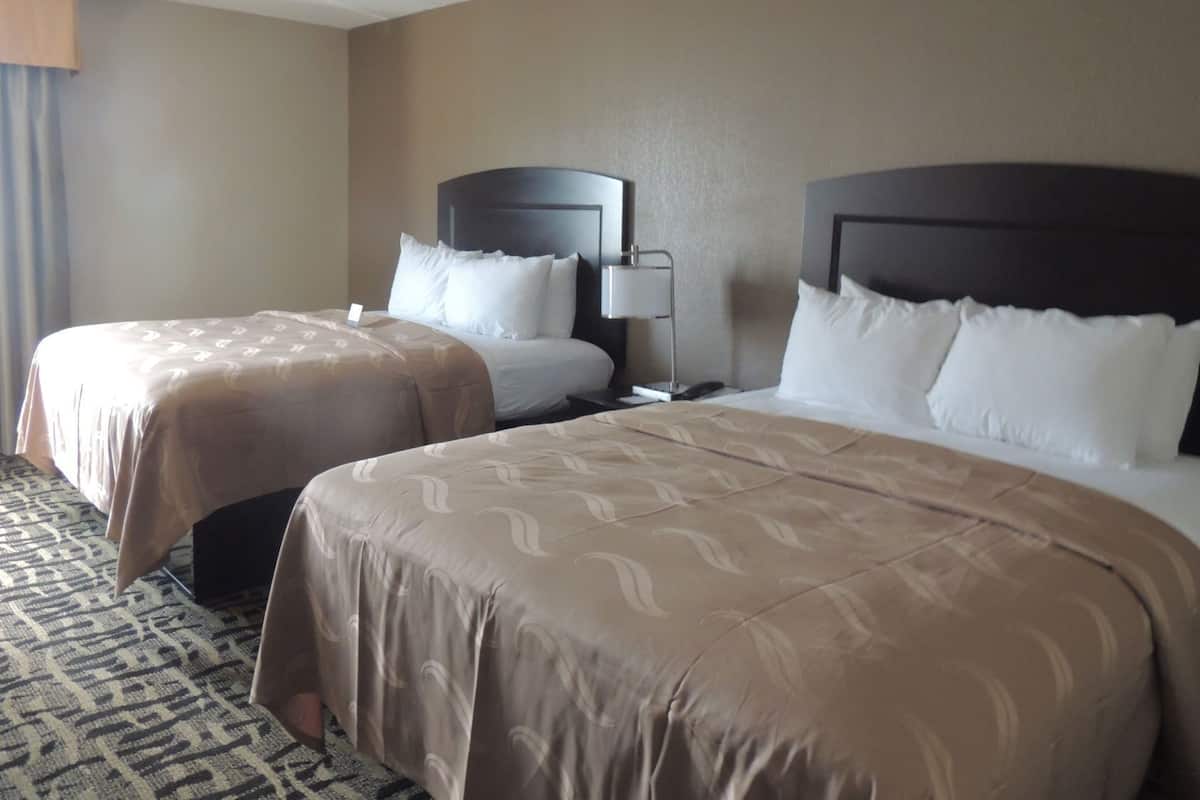 Premium bedding, desk, laptop workspace, iron/ironing board