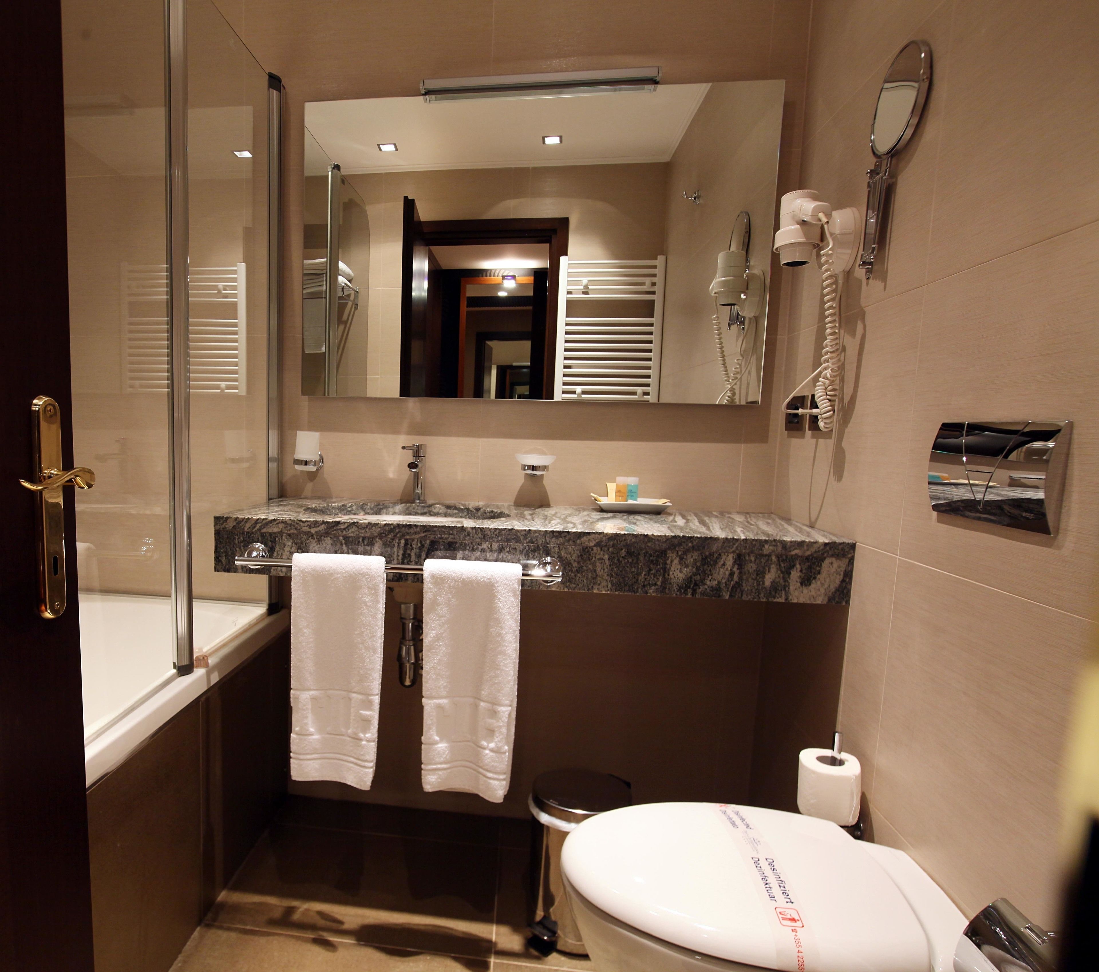 deluxe suite | bathroom | rainfall showerhead, free toiletries, hair dryer, bathrobes