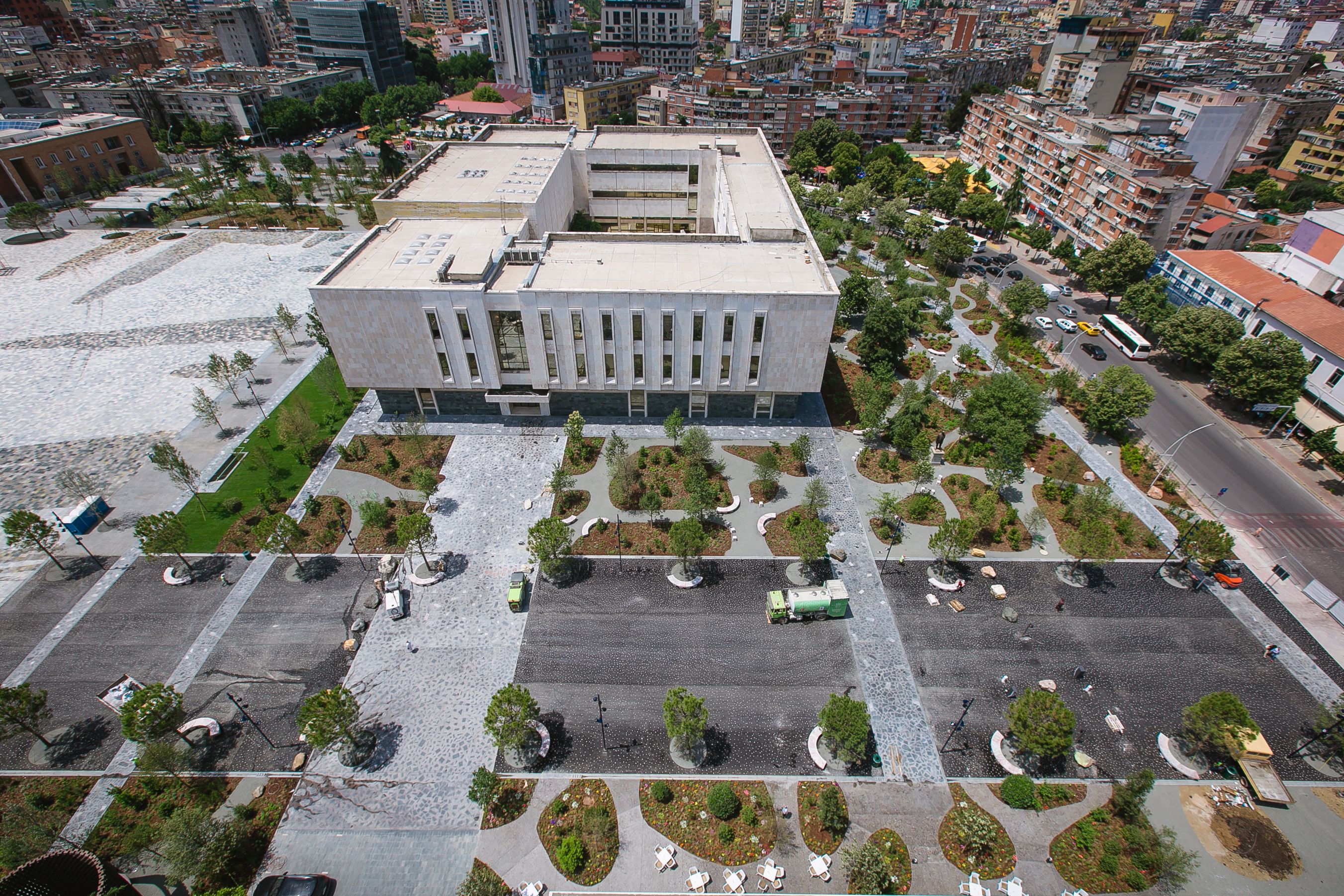 A large, modern building with a flat roof and rectangular windows.