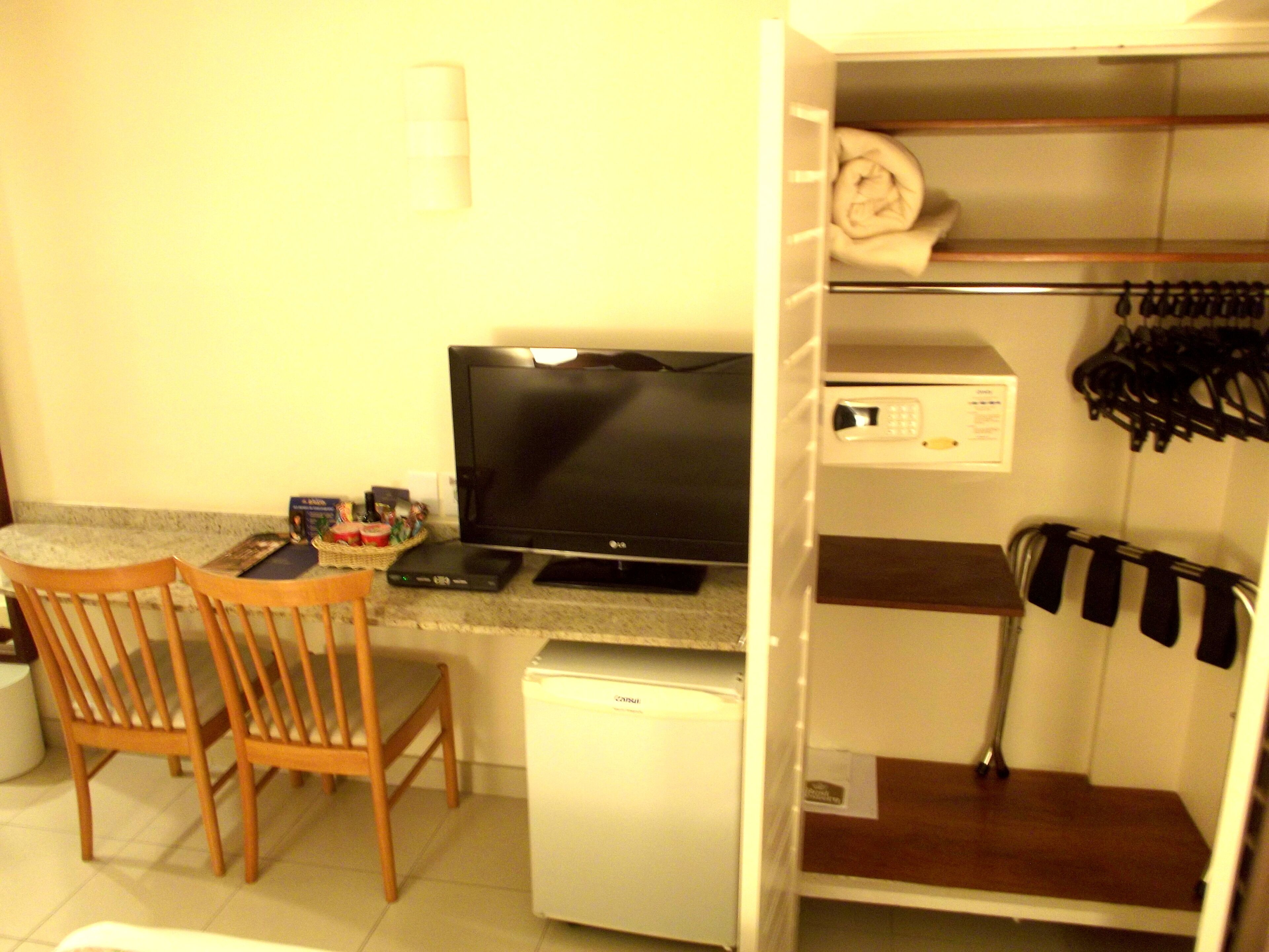 economy room | minibar, in-room safe, desk, blackout curtains