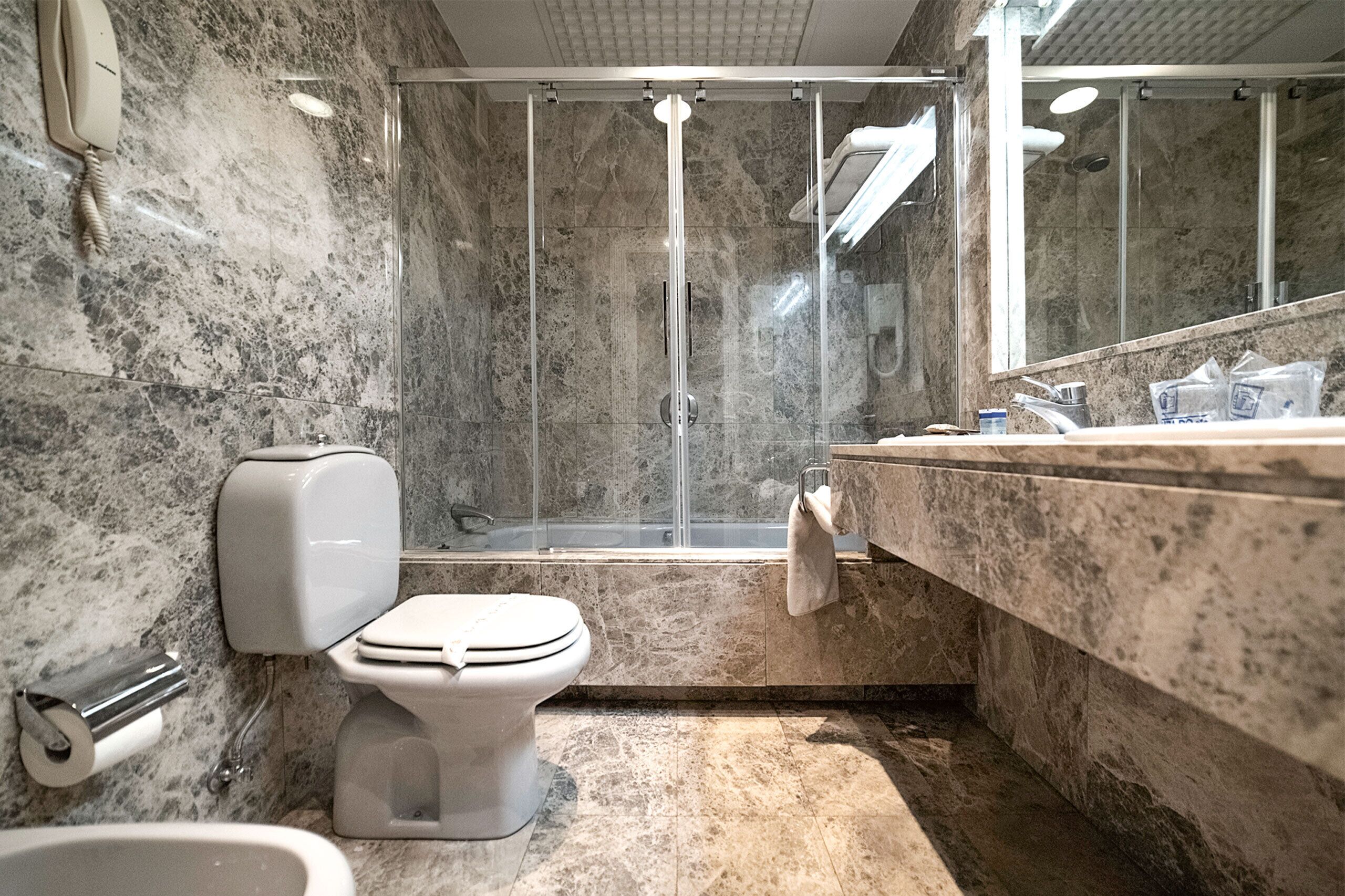 family room | bathroom | shower, hair dryer, bidet, towels