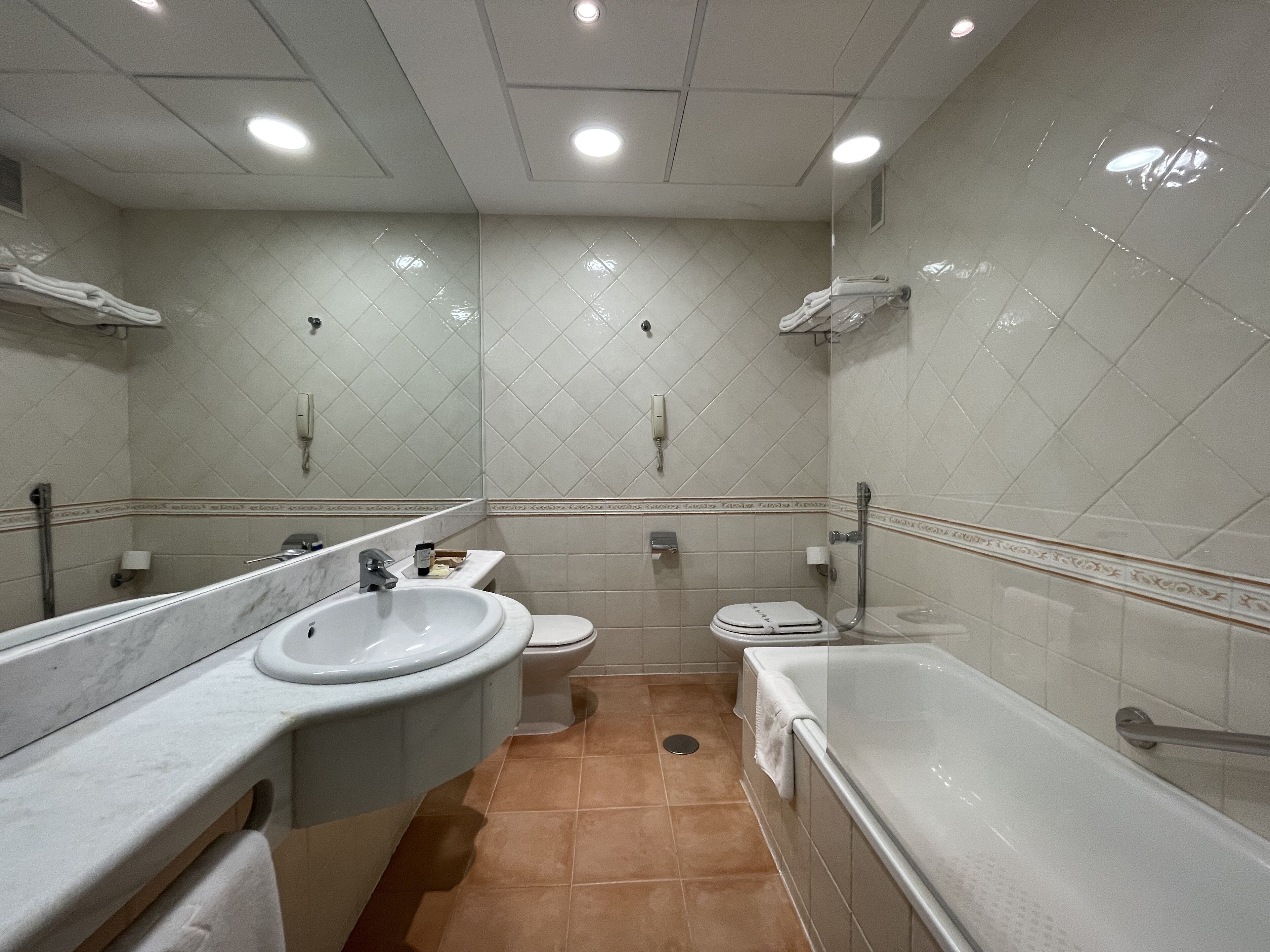 A bathroom with a sink, toilet, and bathtub.