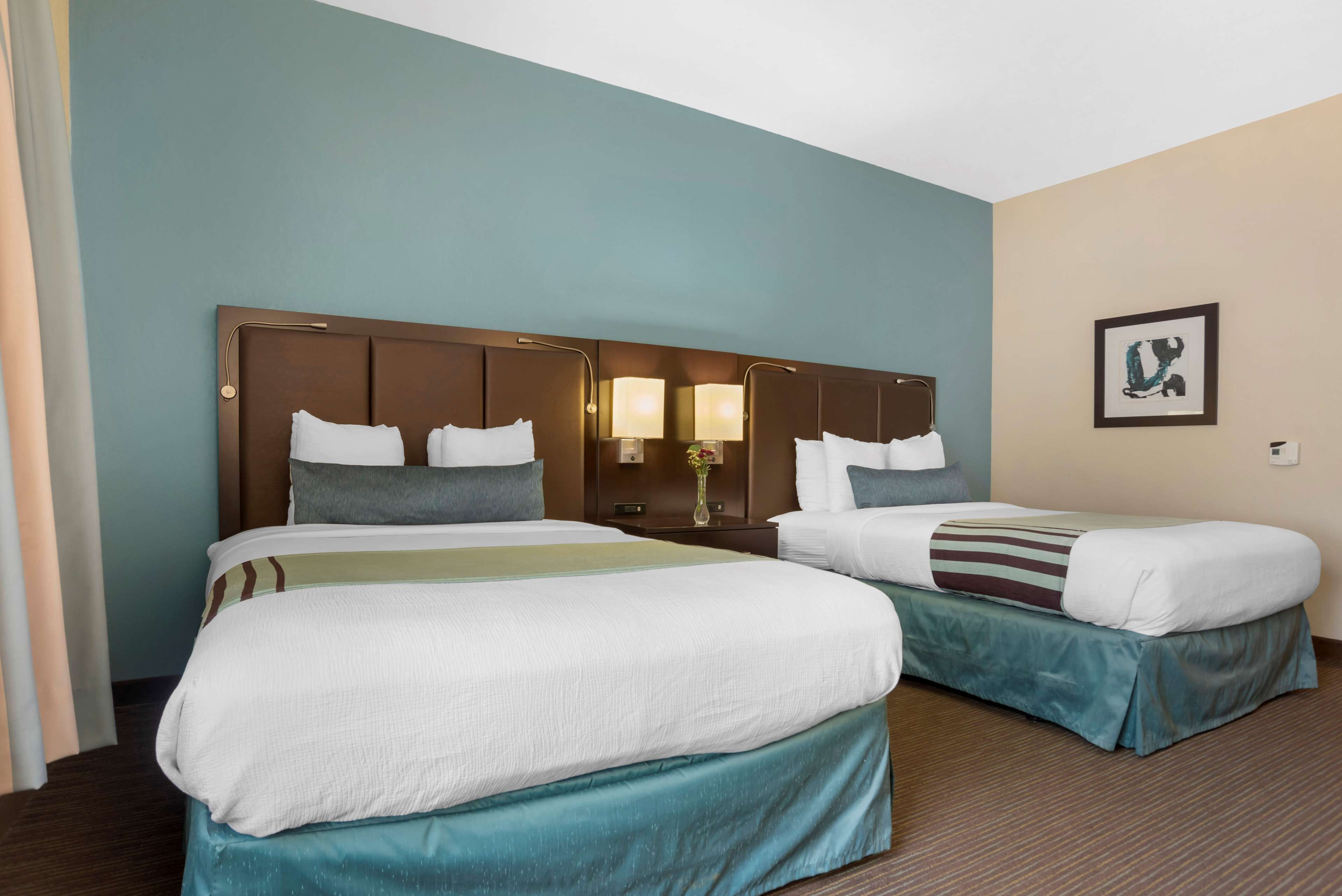 standard room, 2 double beds, refrigerator & microwave | in-room safe, desk, laptop workspace, soundproofing