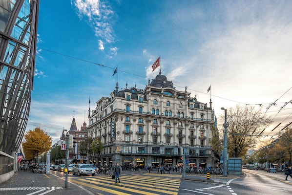 A historic hotel with a classic European architectural style, featuring a prominent dome and multiple balconies.