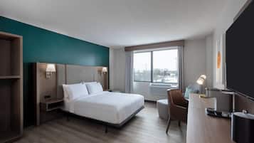 Desk, laptop workspace, blackout drapes, iron/ironing board