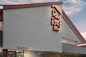 Stylish hotel with a prominent sign and modern design.