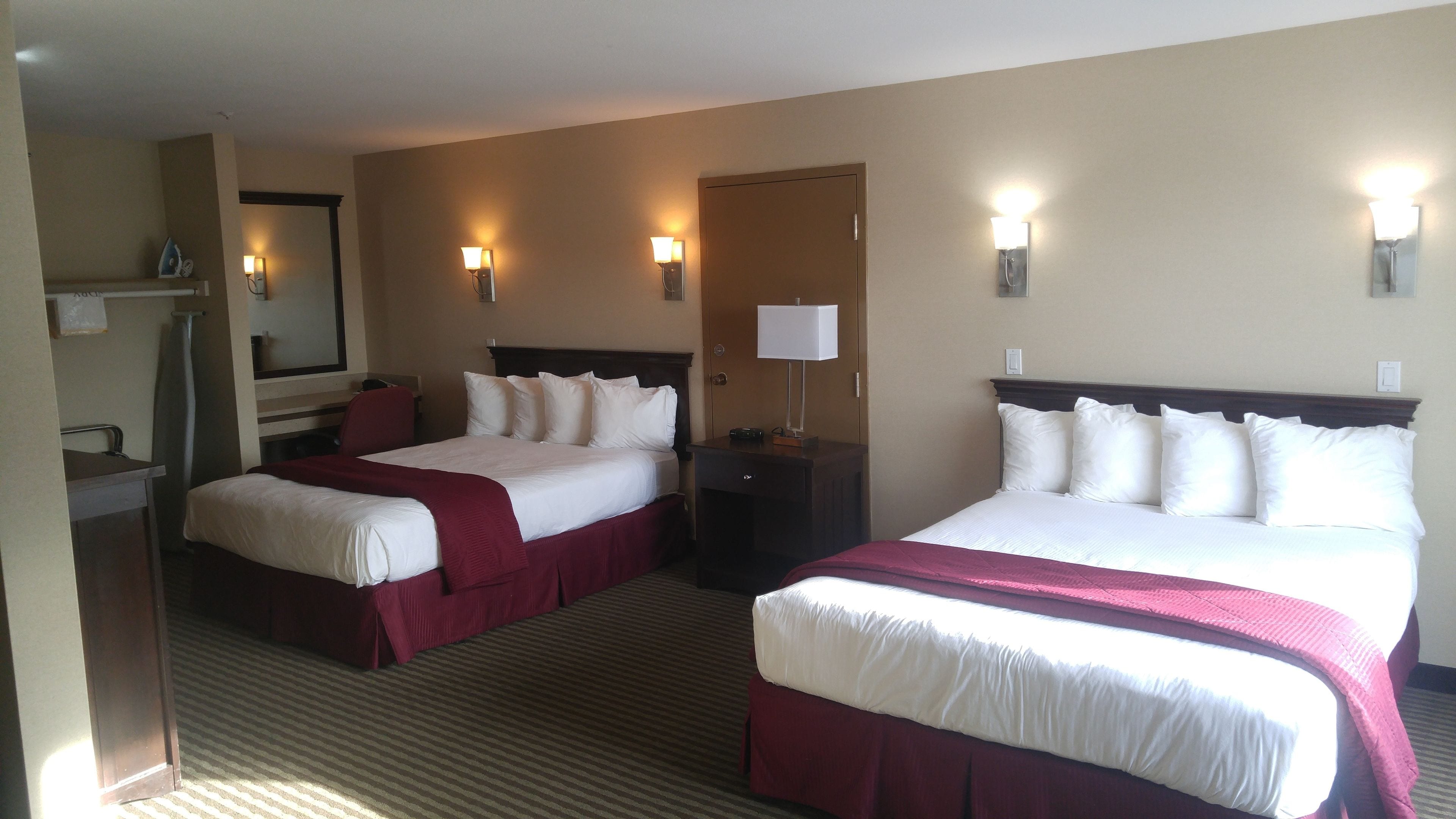 premium bedding, pillow-top beds, desk, blackout curtains