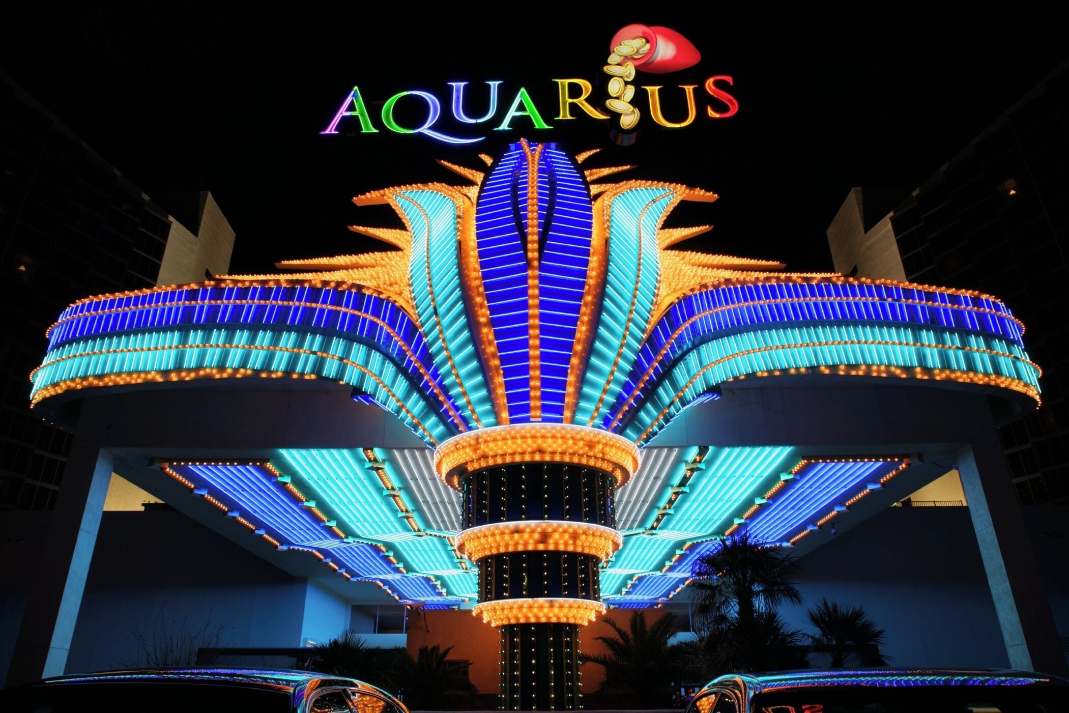 A brightly lit building with the sign "Aquarius" and a distinctive star-shaped structure.