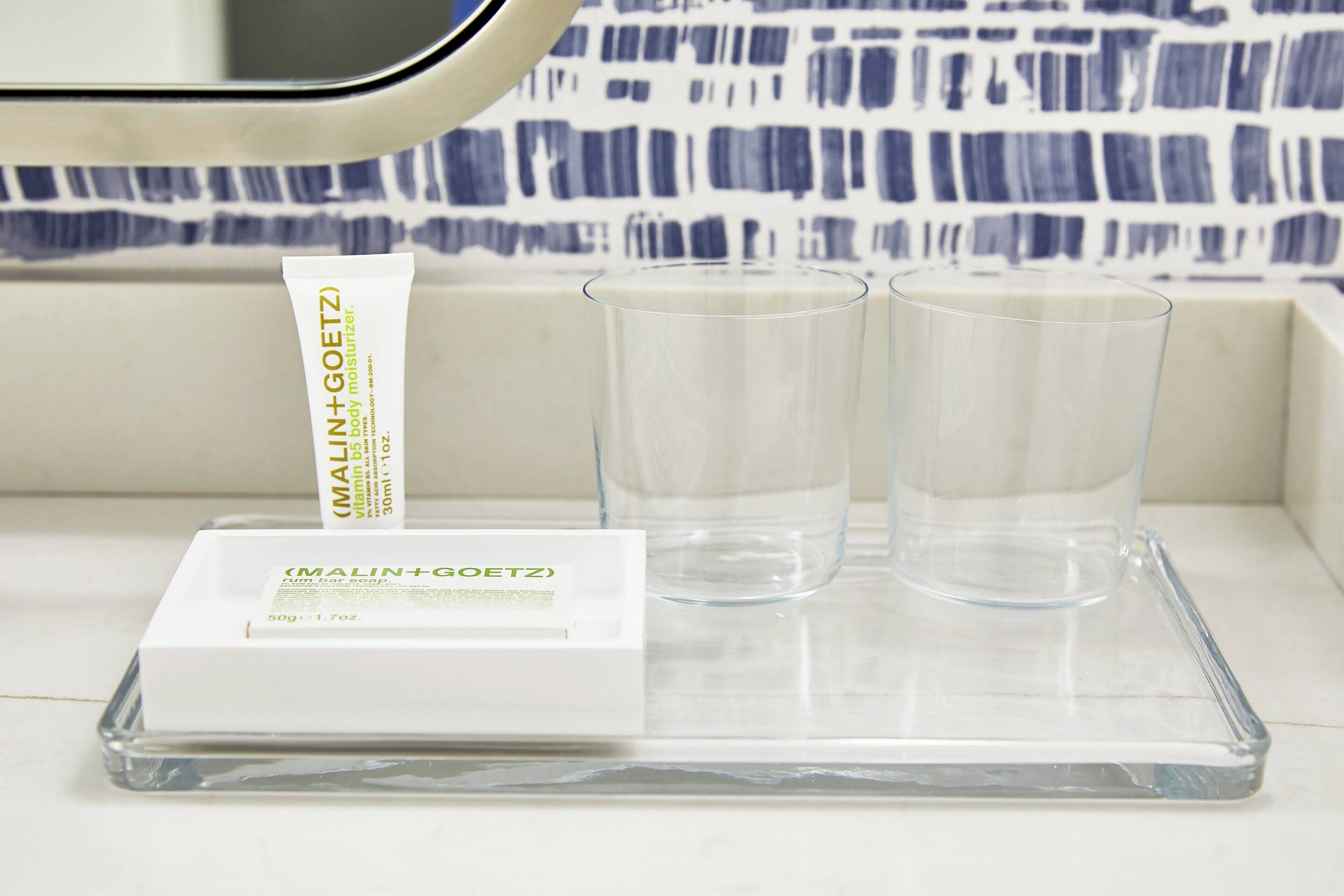 designer toiletries, hair dryer, bathrobes, slippers