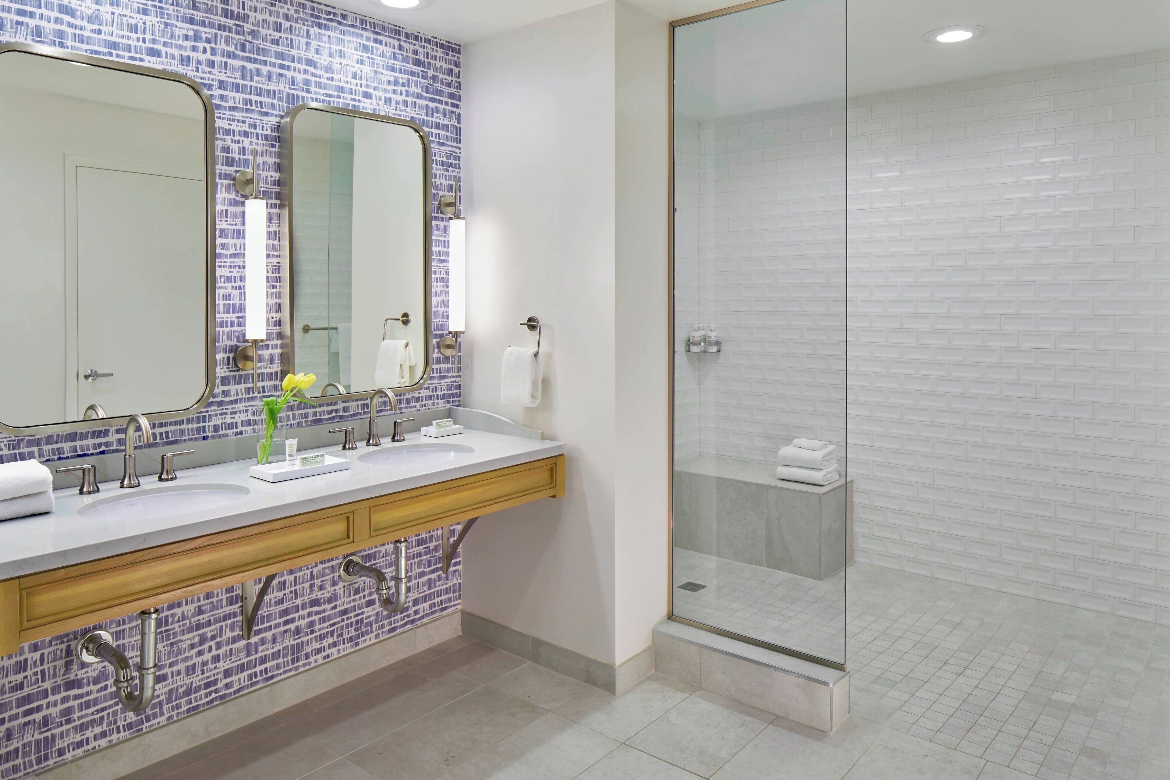 designer toiletries, hair dryer, bathrobes, slippers