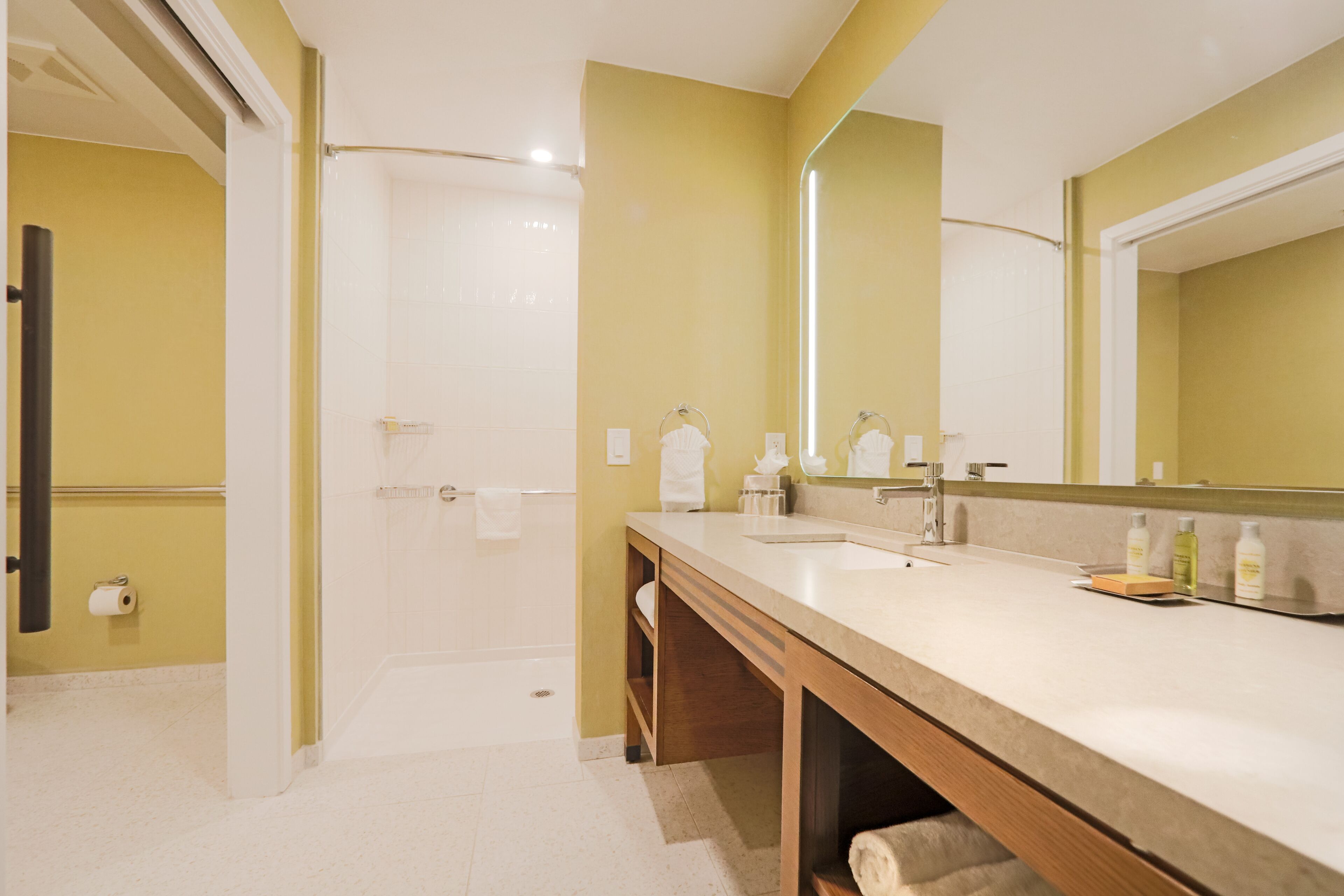 designer toiletries, hair dryer, towels, soap