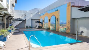 Outdoor pool, open 6:00 AM to 10:00 PM, pool umbrellas, pool loungers