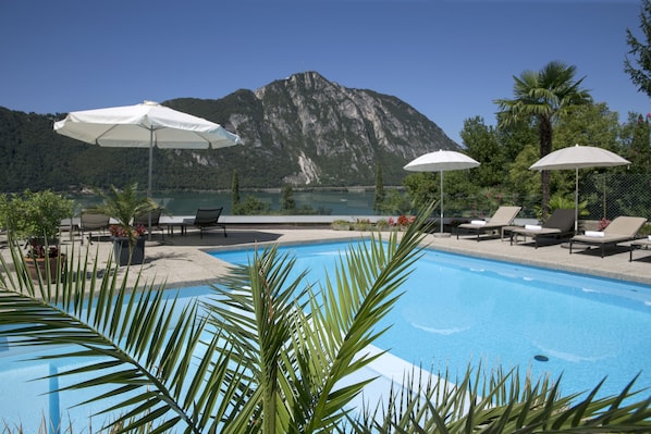 Seasonal outdoor pool, pool umbrellas, pool loungers
