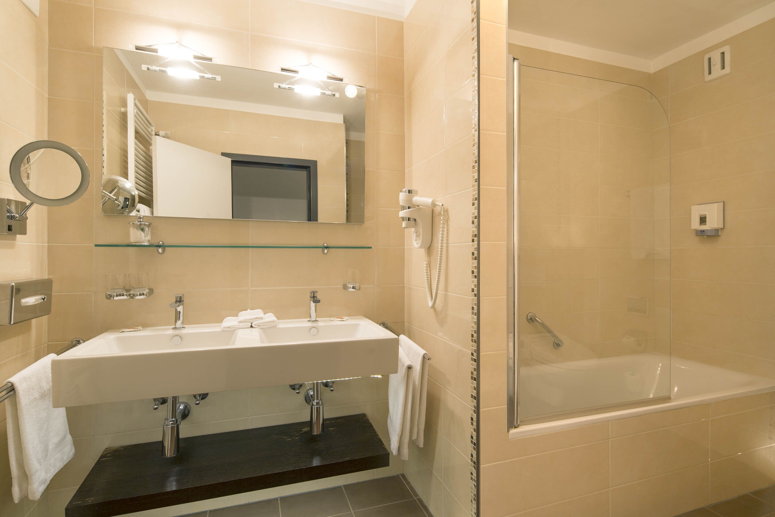 junior studio suite | bathroom | free toiletries, hair dryer, slippers, towels