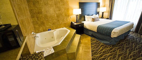 Executive Suite, 1 King Bed, Non Smoking, Jetted Tub | Desk, laptop workspace, blackout drapes, iron/ironing board