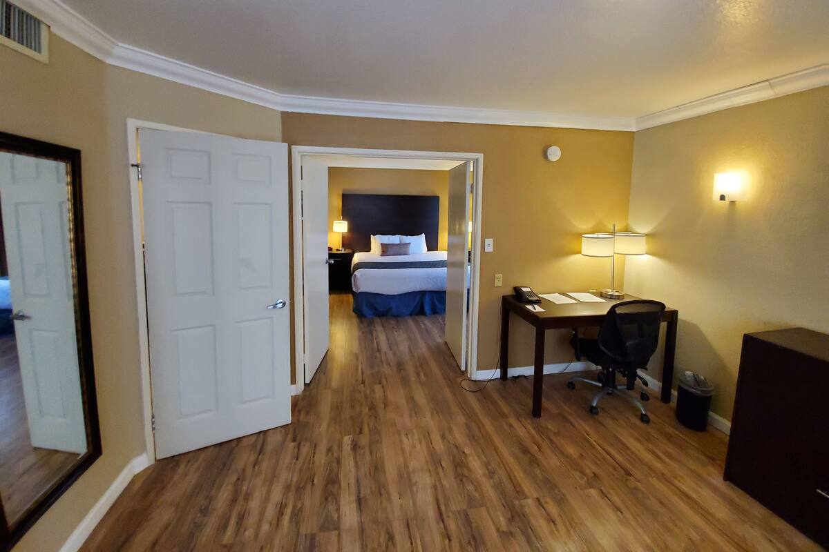 Desk, laptop workspace, blackout curtains, iron/ironing board