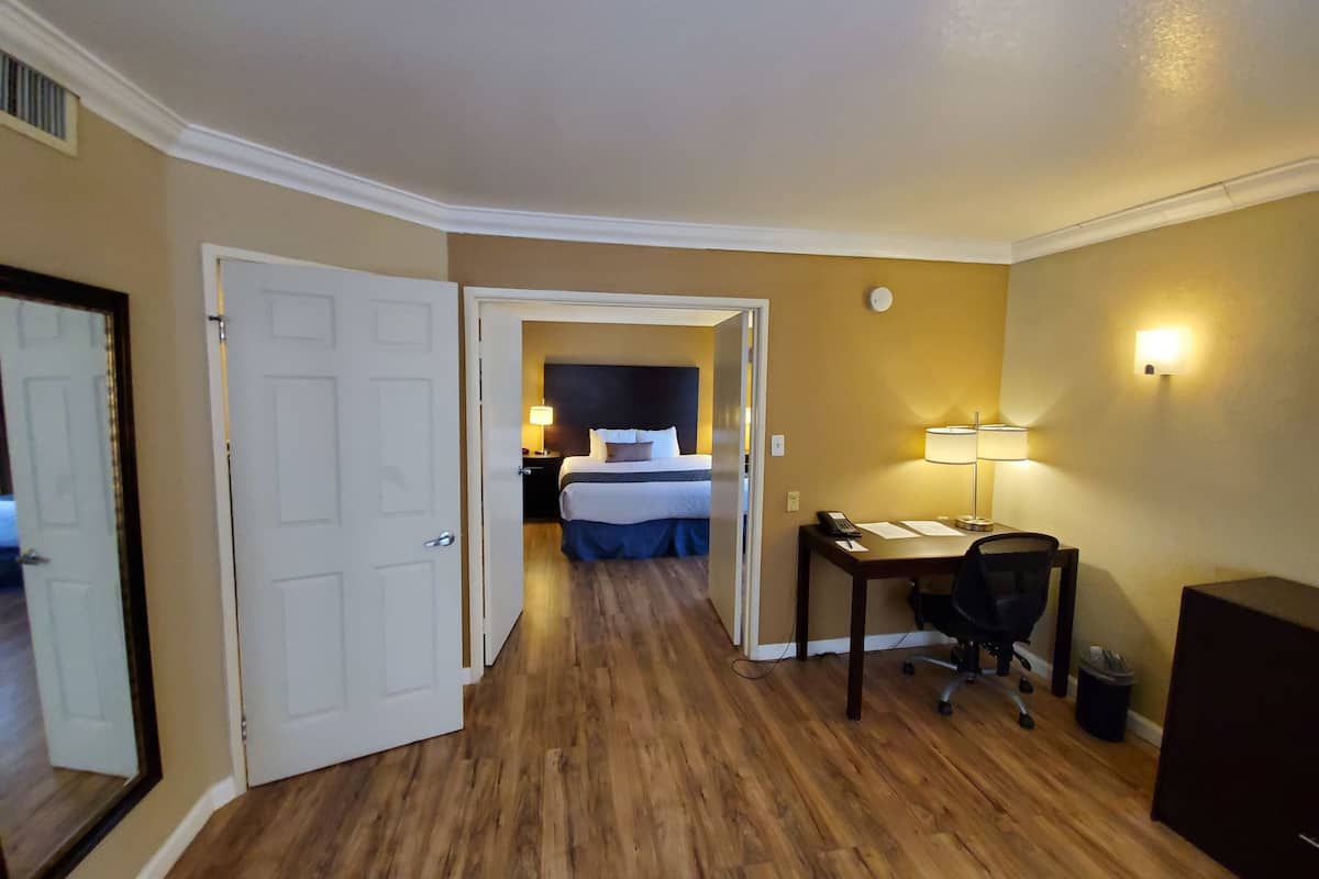 desk, laptop workspace, blackout curtains, iron/ironing board