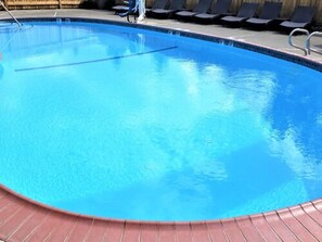 Seasonal outdoor pool, open 9 AM to 10 PM, pool umbrellas, sun loungers
