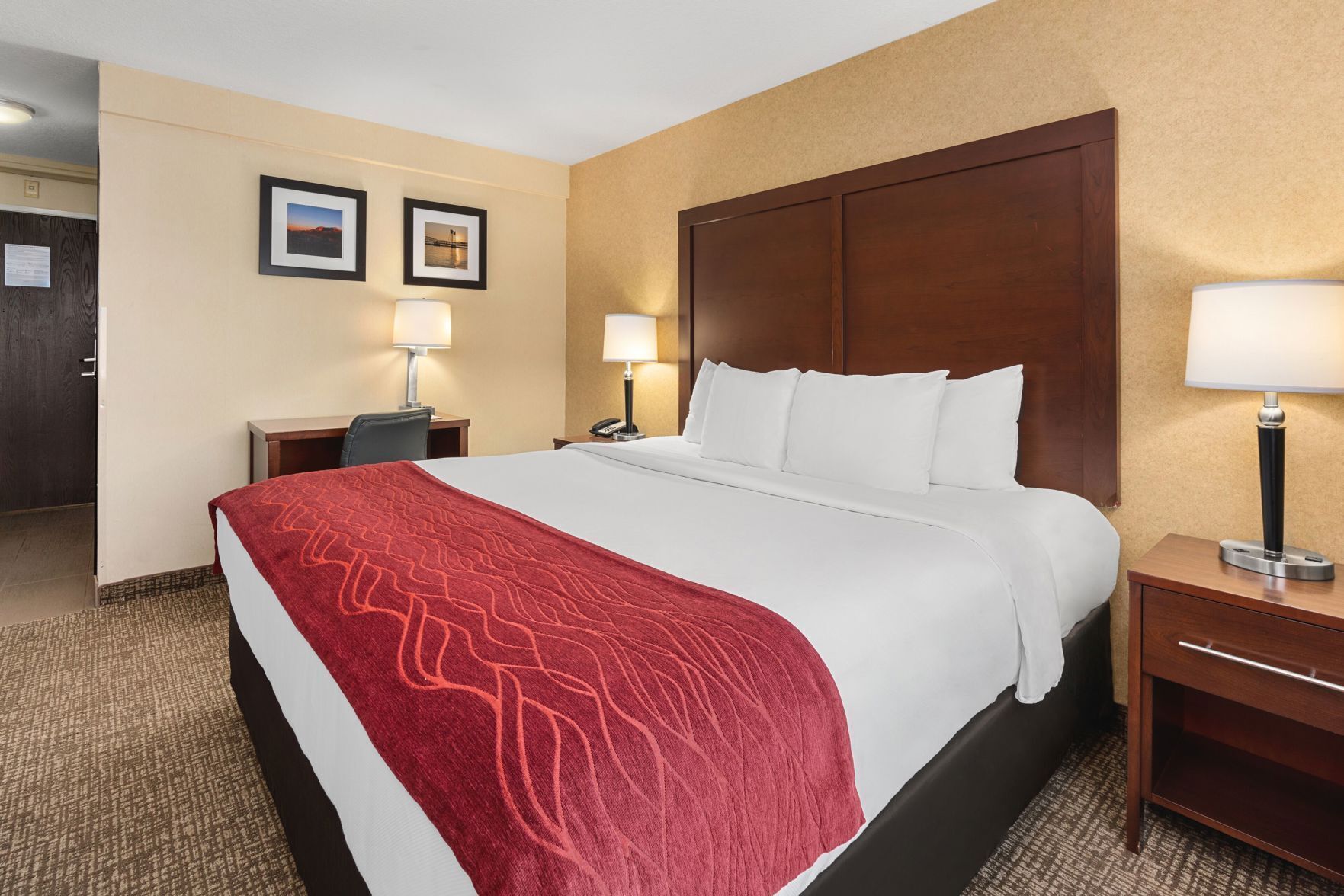 Premium bedding, desk, laptop workspace, blackout drapes