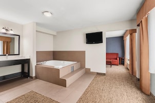 Premium bedding, desk, laptop workspace, blackout drapes