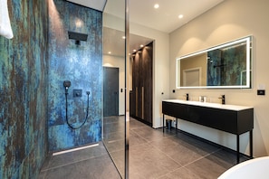 Suite, 1 King Bed, Non Smoking (Larger Room;with Sofabed) | Bathroom | Eco-friendly toiletries, hair dryer, towels