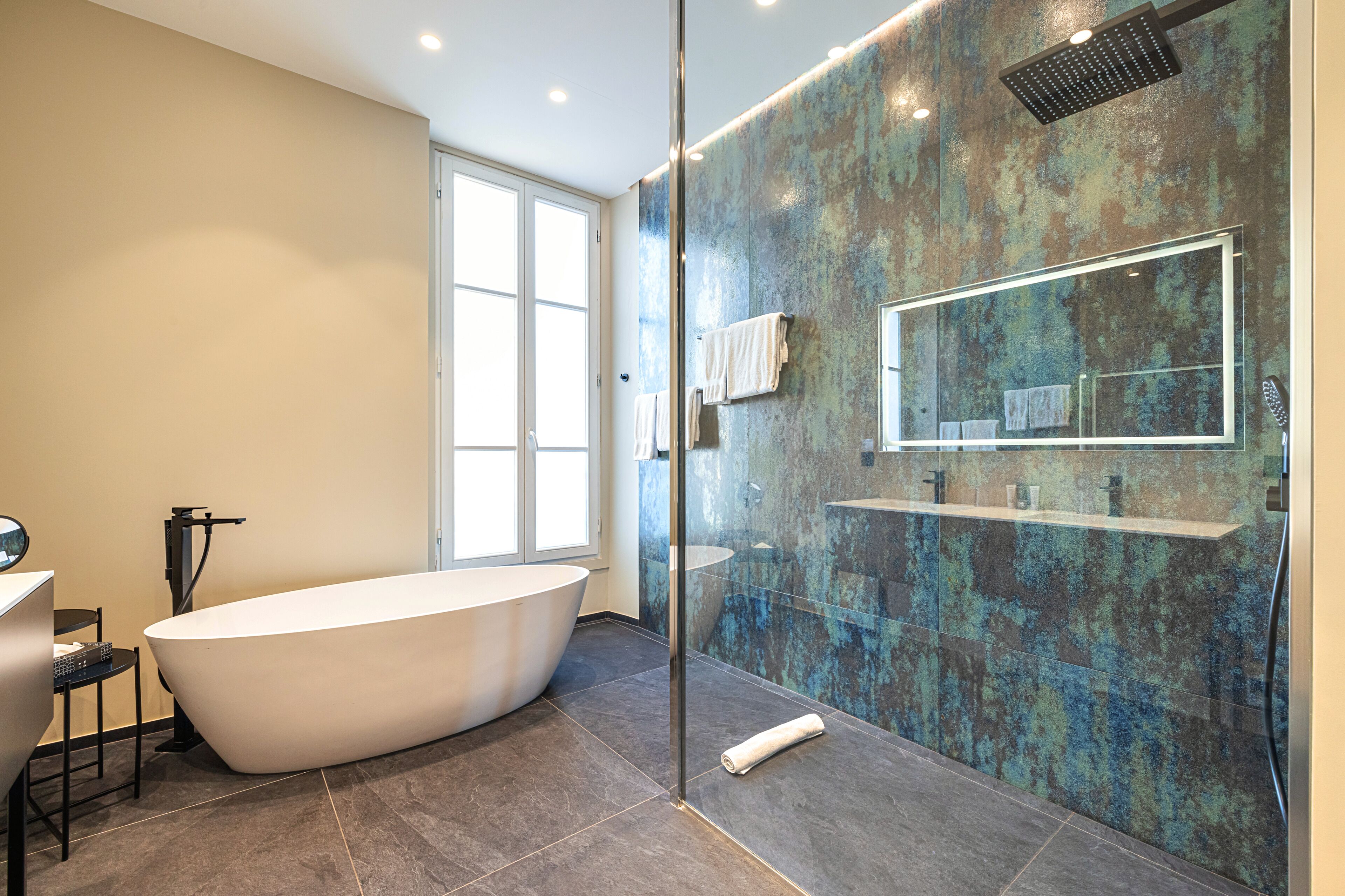 suite, 1 king bed, non smoking (larger room;with sofabed) | bathroom | eco-friendly toiletries, hair dryer, towels