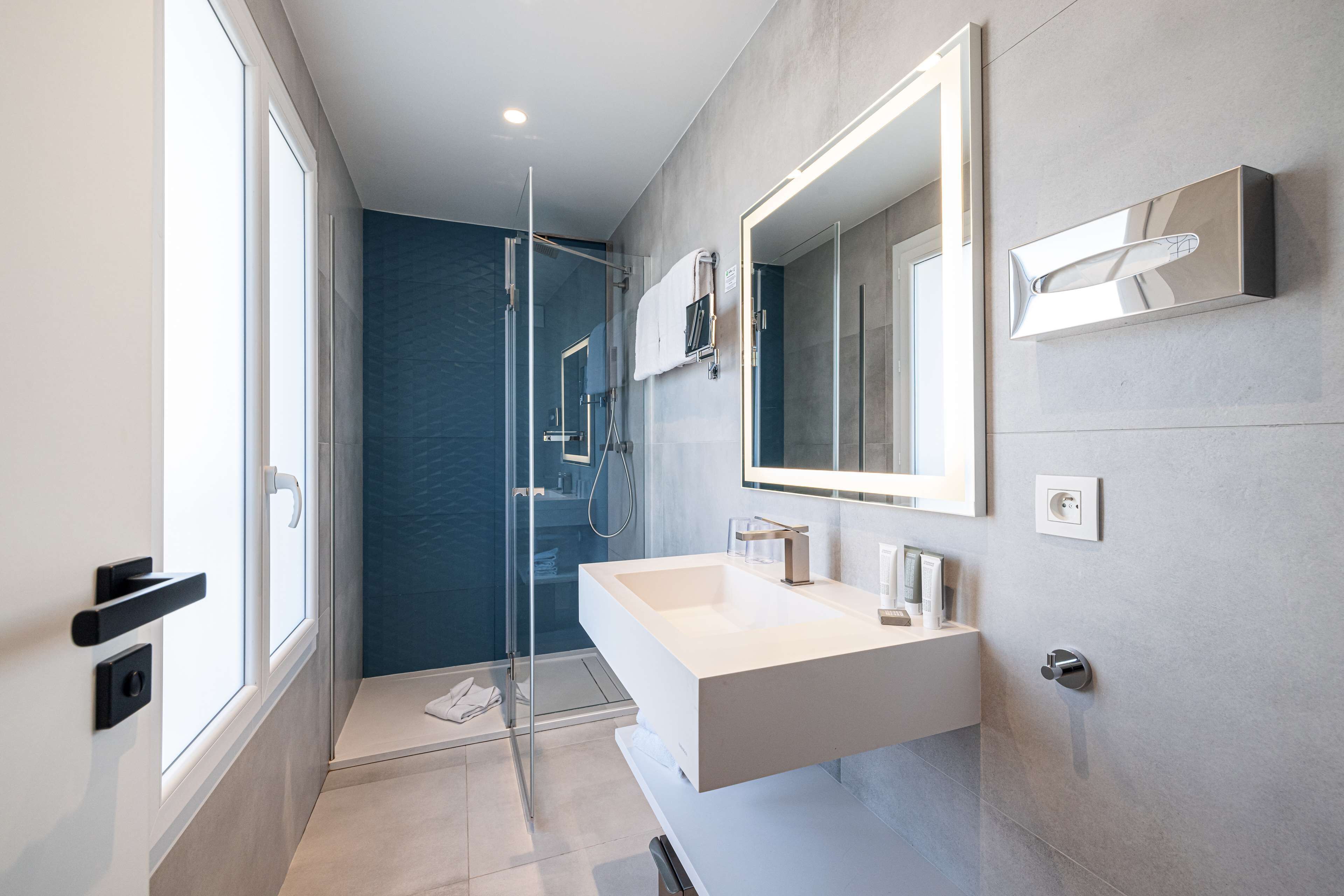 eco-friendly toiletries, hair dryer, towels