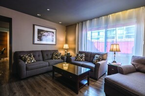 Suite, Multiple Beds (Penthouse) | Living room | 37-inch plasma TV with cable channels, TV, iPod dock