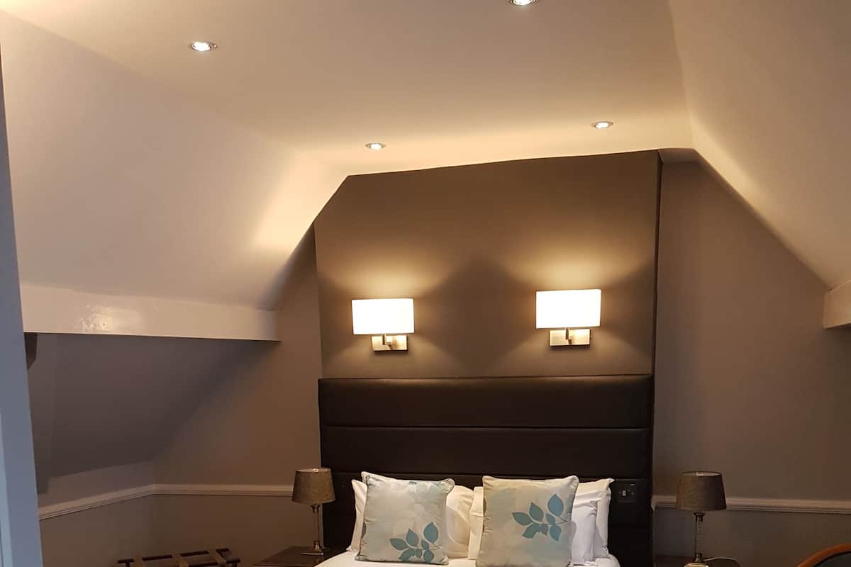 Premium bedding, desk, laptop workspace, iron/ironing board