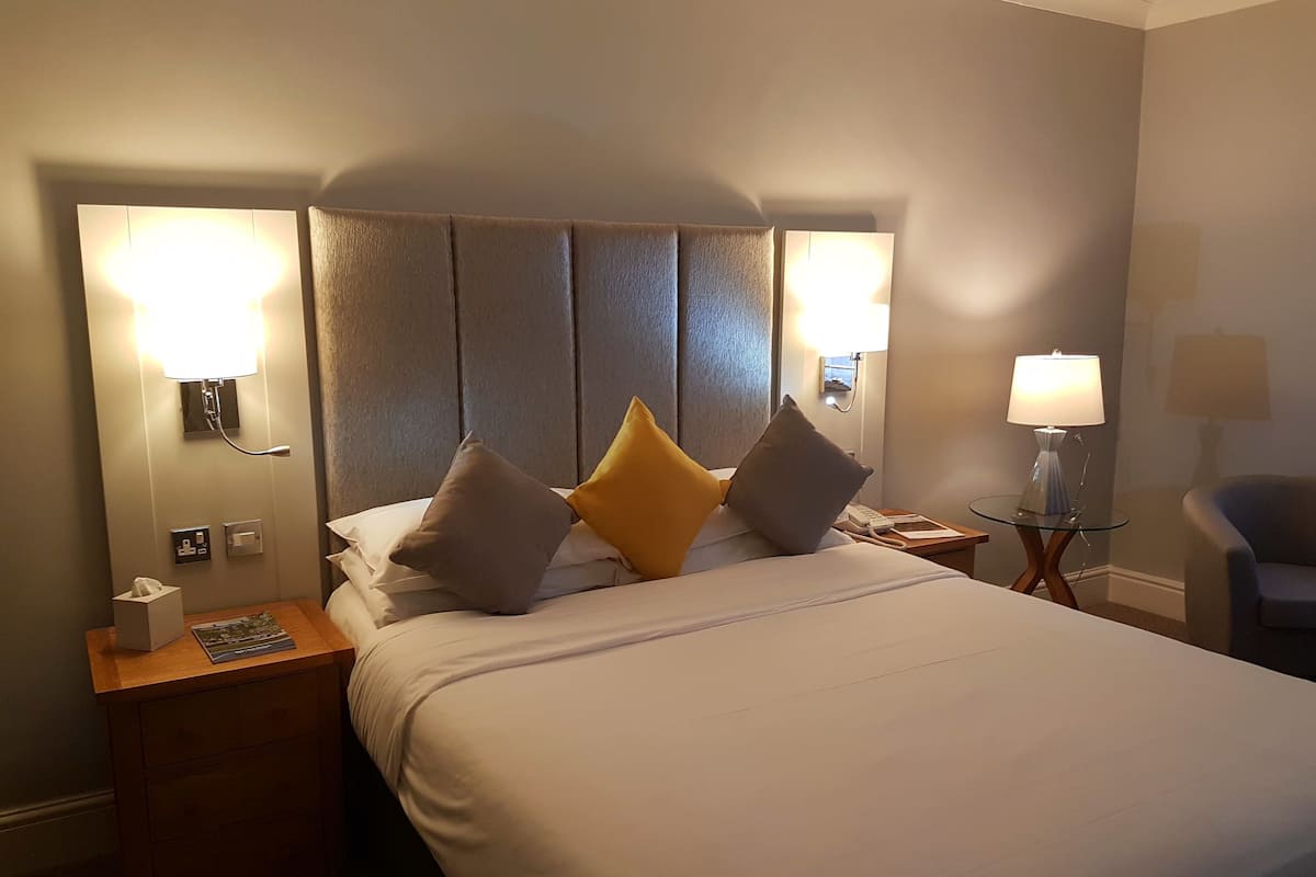 Premium bedding, desk, laptop workspace, iron/ironing board